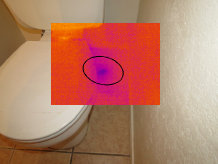 photo of a toilet with a leak leak only visible with infrared thermography inspection