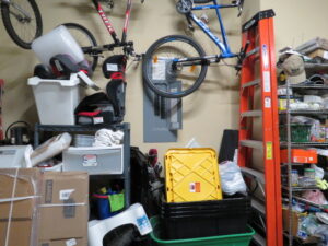 garage clutter blocking access to an electrical panel