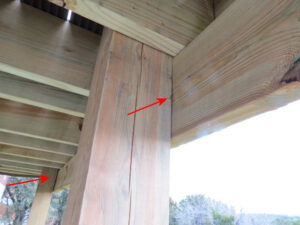 a wooden post supporting a drop beam